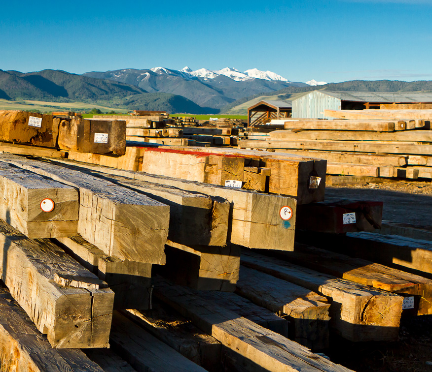 A photo of specialty timbers stacked in our extensive reclaimed lumber yard.