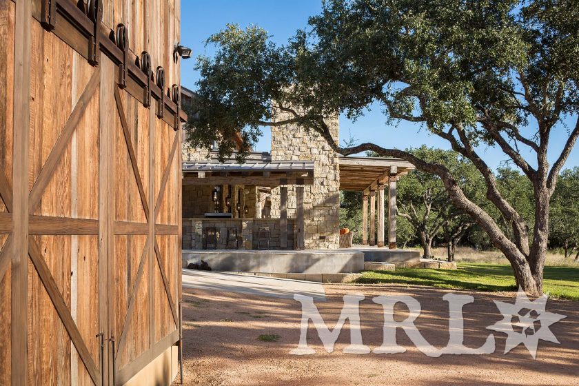 A photo of our antique barnboard, vintage rafter stock, corral board, and century-old hand-hewn beams that make up everything from the timber package and siding to the cabinetry and doors in the Glensprings Ranch project.