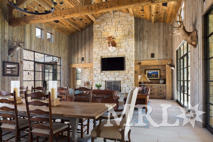 A photo of our antique barnboard, vintage rafter stock, corral board, and century-old hand-hewn beams that make up everything from the timber package and siding to the cabinetry and doors in the Glensprings Ranch project.