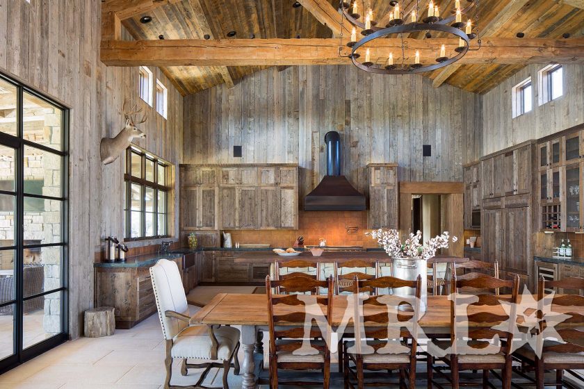 A photo of our antique barnboard, vintage rafter stock, corral board, and century-old hand-hewn beams that make up everything from the timber package and siding to the cabinetry and doors in the Glensprings Ranch project.