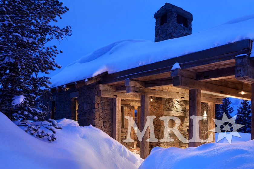 A photo of our reclaimed hand hewn beams and corral board featured throughout the Andesite Ridge project.