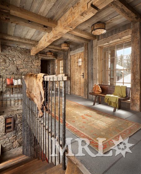 A photo of our reclaimed hand hewn beams and corral board featured throughout the Andesite Ridge project.