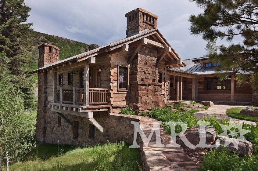 A photo of MRL’s reclaimed hand-hewn timbers and siding, oak wall paneling, trim, and flooring and rafter stock clad ceilings in the Charlie Mountain project.