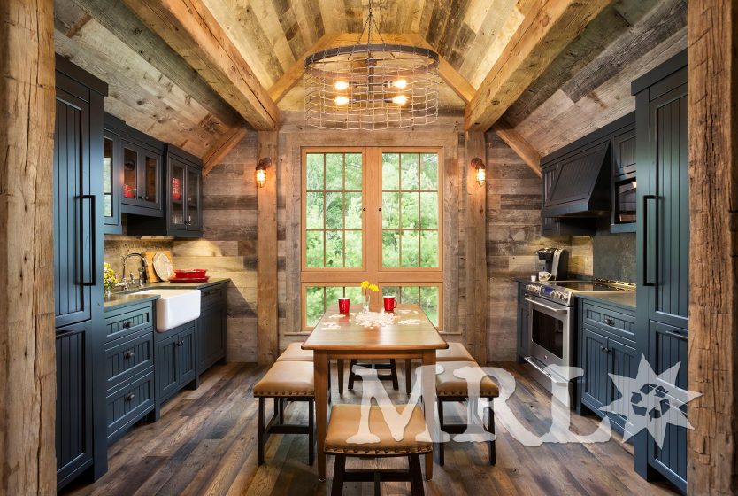 A photo showcasing our reclaimed corral board, barn board, hand-hewn beams and antique Douglas fir timbers in the Lake Country Retreat project.