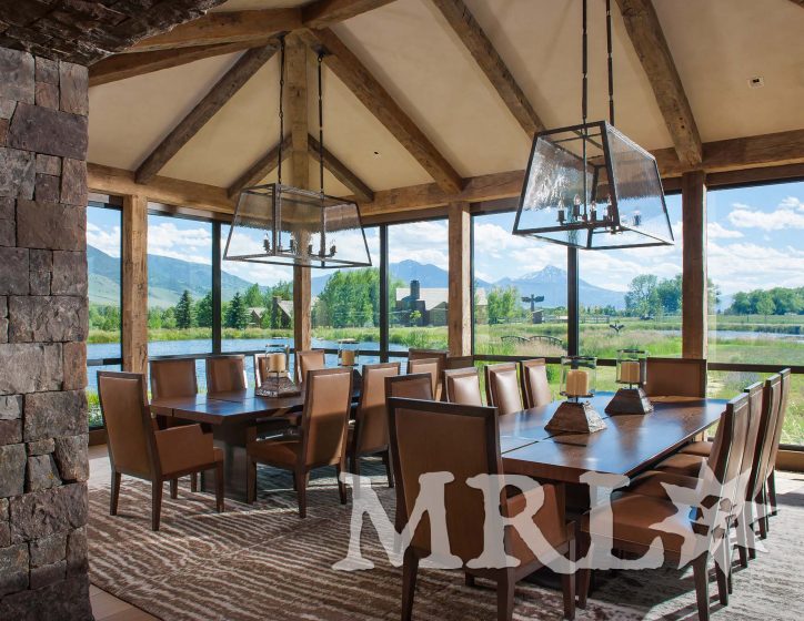 A photo of our oak ceiling paneling and hand-hewn timbers inside and out of the Legacy Ranch project.