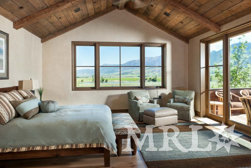 A photo of our oak ceiling paneling and hand-hewn timbers inside and out of the Legacy Ranch project.