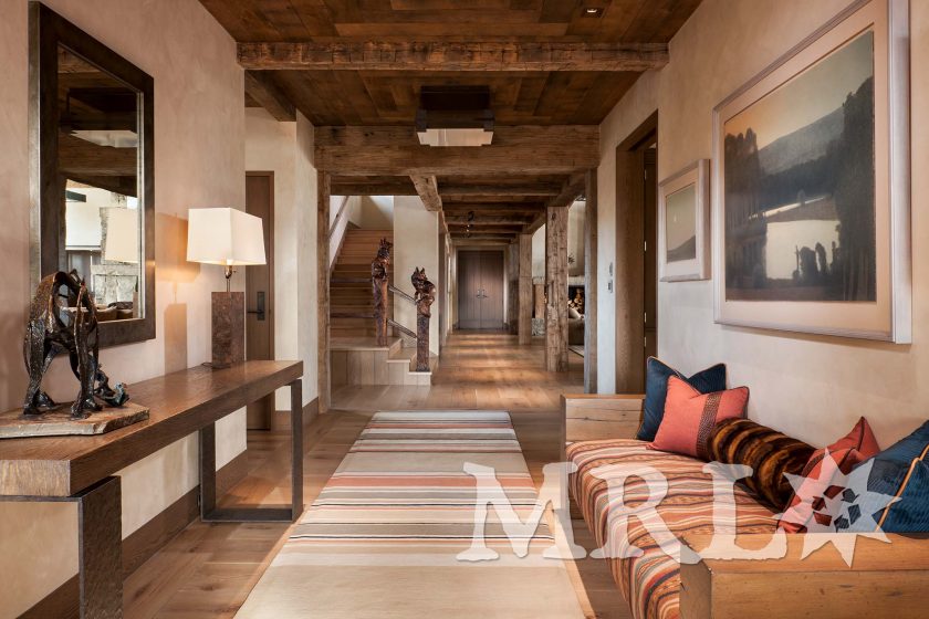 A photo of our oak ceiling paneling and hand-hewn timbers inside and out of the Legacy Ranch project.